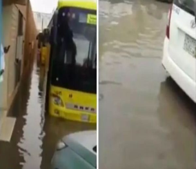 "فيديو" شاهد أب يستخدم طريقة خاصة في نقل ابنته من المدرسة إلى السيارة بعد هطول الأمطار 3